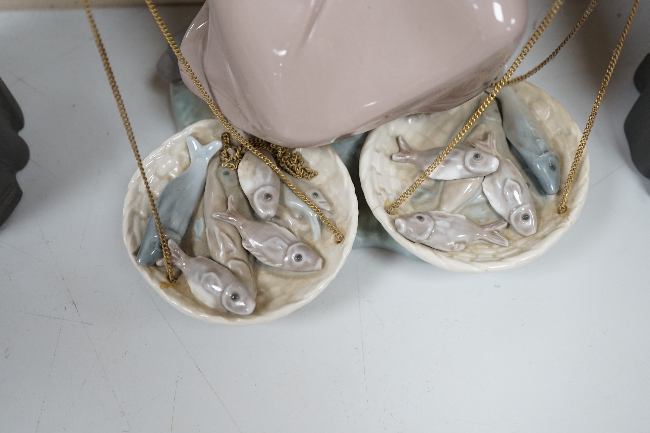 Three Lladro figures, 25cms high